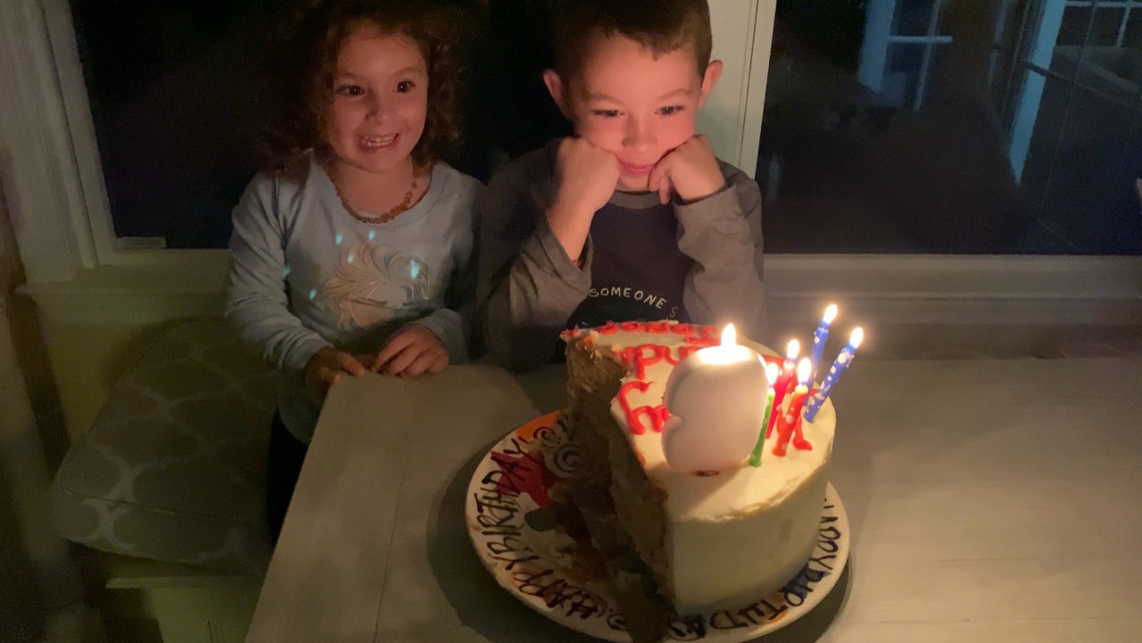 Jim’s children beside the half-eaten birthday cake that inspired No Half Cakes